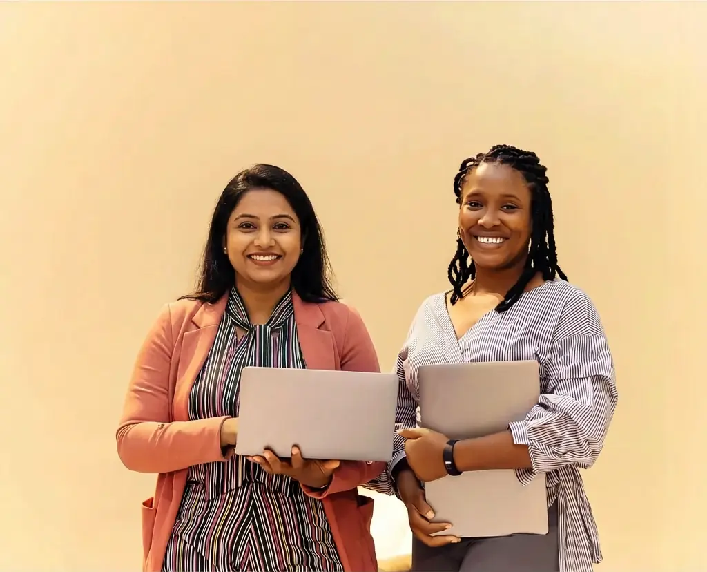 Two health-care professionals holding notebooks, representing training and educational resources for abortion care providers