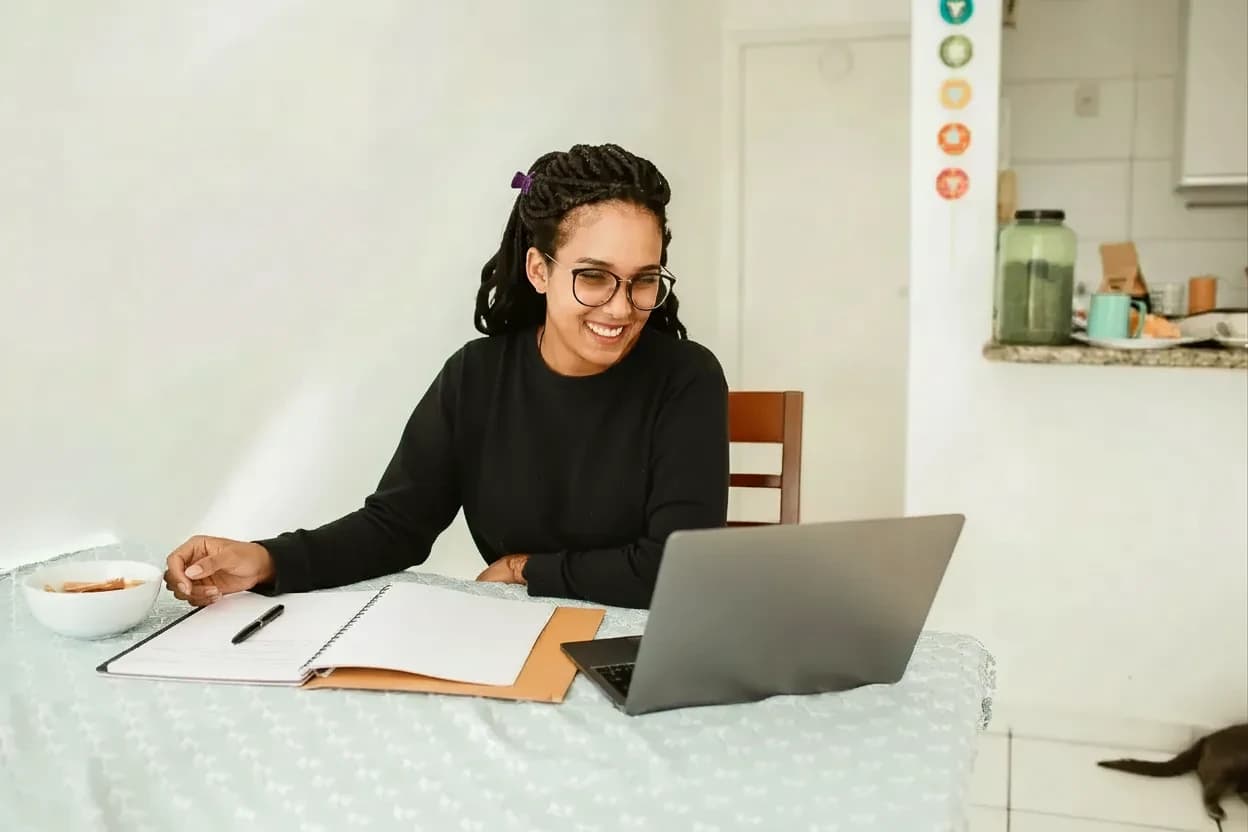 Woman using a laptop to access online health-care training